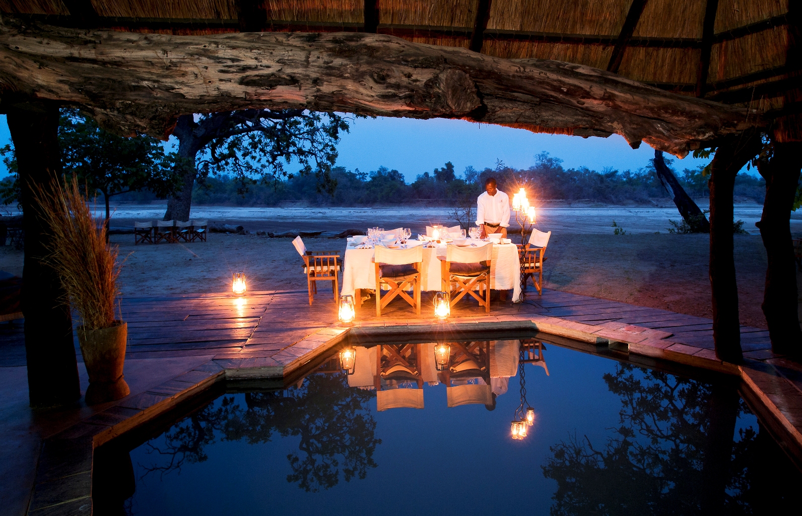 Dinner by the pool - Mchenja Bush Camp